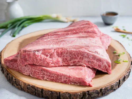 Two (2) whole Natural American Wagyu Boneless Chuck Short Ribs. Each vacuum sealed bag contains 2 pieces. Perfect for braising or slicing for Japanese Style Barbecue (Yakiniku). Natural American Wagyu from hand-selected farms across the United States. Hormone and Antibiotic Free.  This product ships frozen overnight in a temperature controlled box. Thawing is normal during shipment. Product of the United States. View Shipping Information and select your desired delivery date at checkout. Schedule shipments up to 3 months in advance.